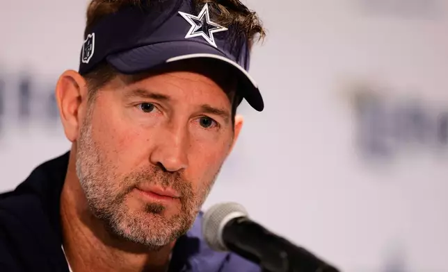Dallas Cowboys head coach Brian Schottenheimer speaks during a practice for an NFL football game against the Baltimore Ravens in Rio de Janeiro, Friday, Sept. 25, 2026. (AP Photo/Lucas Figueiredo)