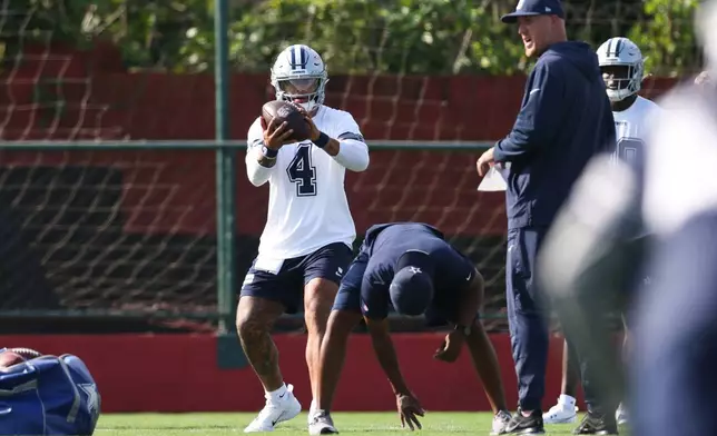 Dallas Cowboys quarterback Dak Prescott (4) works out during a practice for an NFL football game against the Baltimore Ravens in Rio de Janeiro, Friday, Sept. 25, 2026. (AP Photo/Lucas Figueiredo)