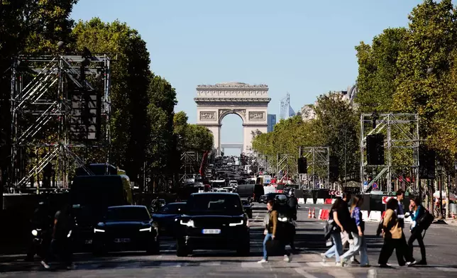 The Champs Elysees prepares for the mass that Pope Leo XIV will celebrate during his visit in Paris, Wednesday, Sept. 23, 2026. (AP Photo/Teresa Suarez)