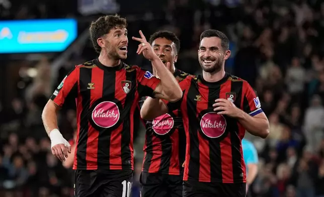 Bournemouth's Ryan Christie, left, celebrates scoring during the League Cup third round soccer match between AFC Bournemouth and Lincoln City in Bournemouth, England, Tuesday Sept. 8, 2026. (Andrew Matthews/PA via AP)