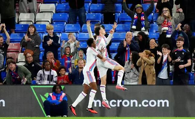 Crystal Palace's Jorgen Strand Larsen, right, celebrates after scoring his sides first goal during the third round soccer match between Crystal Palace and Middlesbrough at Selhurst Park, London, Tuesday, Sept. 8, 2026. (Bradley Collyer/PA via AP)