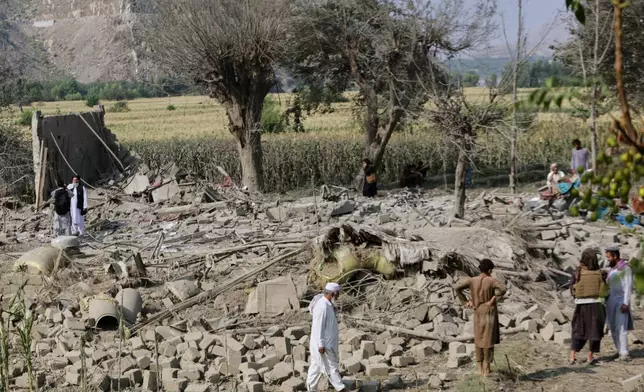 Residents inspect the rubble of a house destroyed in a strike in Patan village, Kunar province, eastern Afghanistan, Monday, Sept. 21, 2026. (AP Photo/Shafiullah Kakar)