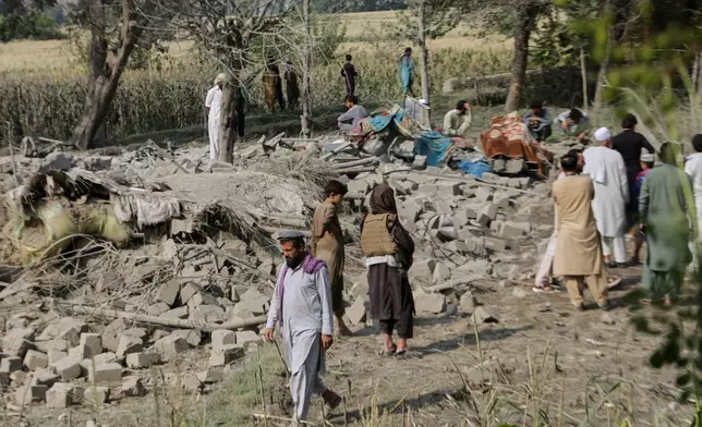 Residents inspect the rubble of a house destroyed in a strike in Patan village, Kunar province, eastern Afghanistan, Monday, Sept. 21, 2026. (AP Photo/Shafiullah Kakar)
