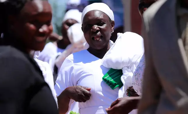 Quakerism faithful walk outside Friends Church Cheptulu in Kaimosi, Kenya after a service, in Kaimosi, Kenya, Sunday, Sept. 20, 2026. (AP Photo/Jackson Njehia)