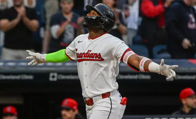 Cleveland Guardians' Angel Martinez reacts after hitting a two-run home run off Athletics starting pitcher Jacob Lopez during the first inning of a baseball game, Saturday, Sept. 19, 2026, in Cleveland. (AP Photo/Phil Long)