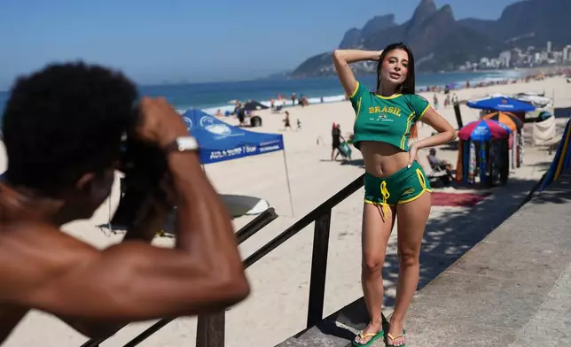 Influencer Gabriela Catao poses for photos at Ipanema beach in Rio de Janeiro, on Sept. 4, 2026. (AP Photo/Silvia Izquierdo)