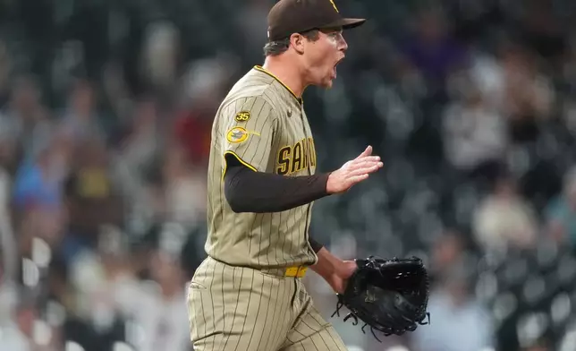 San Diego Padres relief pitcher Mason Miller reacts after third baseman Manny Machado fielded a ground ball and put out Colorado Rockies' Adael Amador to end the ninth inning of a baseball game Monday, Sept. 14, 2026, in Denver. (AP Photo/David Zalubowski)