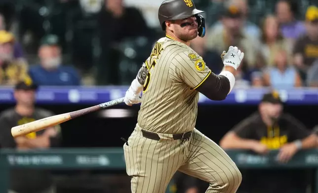 San Diego Padres' Ty France watches his RBI single off Colorado Rockies relief pitcher Mark Manfredi in the seventh inning of a baseball game Monday, Sept. 14, 2026, in Denver. (AP Photo/David Zalubowski)