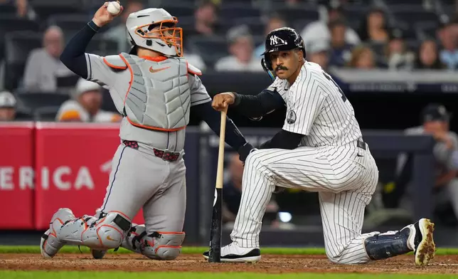 New York Yankees' Trent Grisham reacts after an inside pitch during the sixth inning of a baseball game against the Houston Astros Tuesday, Aug. 25, 2026, in New York. (AP Photo/Frank Franklin II)