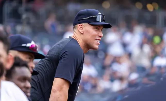 New York Yankees' Aaron Judge looks on from the dugout in the eighth inning during a baseball game against the Boston Red Sox, Sunday, Aug. 30, 2026, in New York. (AP Photo/Corey Sipkin)