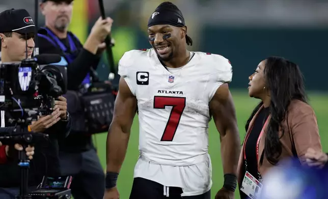 Atlanta Falcons' Bijan Robinson smiles after an NFL football game against the Green Bay Packers in Green Bay, Wis., Thursday, Sept. 24, 2026. (AP Photo/Matt Ludtke)
