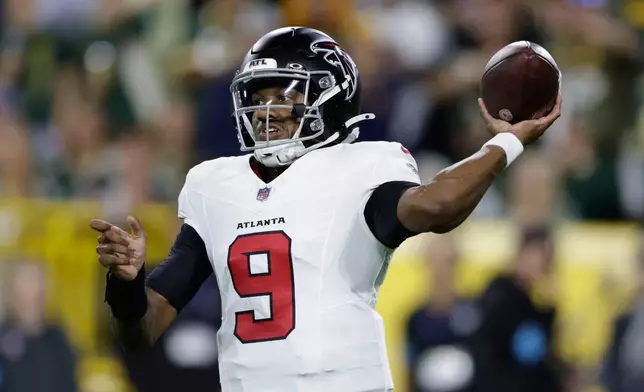 Atlanta Falcons' Michael Penix Jr. throws during the first half of an NFL football game against the Green Bay Packers in Green Bay, Wis., Thursday, Sept. 24, 2026. (AP Photo/Matt Ludtke)