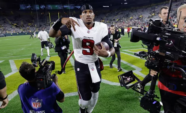 Atlanta Falcons' Michael Penix Jr. reacts after an NFL football game against the Green Bay Packers in Green Bay, Wis., Thursday, Sept. 24, 2026. (AP Photo/Mike Roemer)