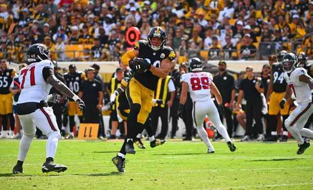 Pittsburgh Steelers outside linebacker T.J. Watt (90) intercepts a pass during an NFL football game against the Atlanta Falcons, Sunday, Sept. 13, 2026, in Pittsburgh. (AP Photo/Justin Berl)