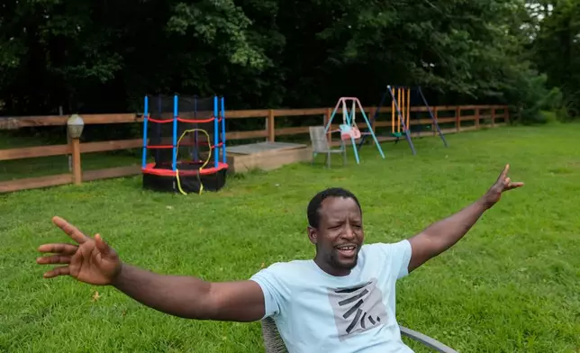 Khalidou Sy, a Mauritanian immigrant, talks in the backyard of his family's home in Lockland, Ohio, Friday, July 31, 2026. Sy feels like he’s part of a great American tradition, the “melting pot,” he said, like the Irish and Italians before him. (AP Photo/Carolyn Kaster)
