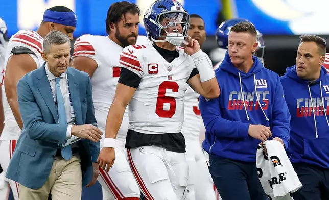 New York Giants quarterback Jaxson Dart (6) walks off the field with an injury during the first half of an NFL football game against the Los Angeles Rams in Inglewood, Calif., Monday, Sept. 21, 2026. (AP Photo/Caroline Brehman)