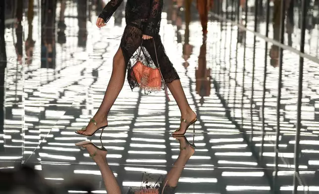 A model wears a creation as part of the Fendi Spring/Summer 2027 Women's collection presented in Milan, Italy, Wednesday, Sept. 23, 2026. (AP Photo/Antonio Calanni)