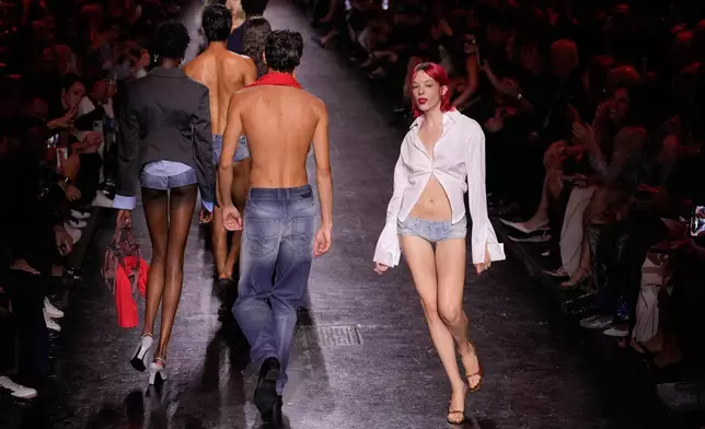 Models wear creations part of the Diesel women's Spring-Summer 2027 collection presented in Milan, Italy, Tuesday, Sept. 22, 2026. (AP Photo/Luca Bruno).