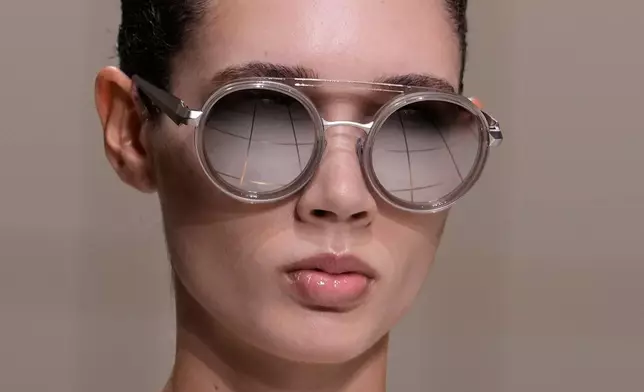 A model wears a creation part of the Giorgio Armani women's Spring-Summer 2027 collection, presented in Milan, Italy, Sunday, Sept. 27, 2026. (AP Photo/Luca Bruno)