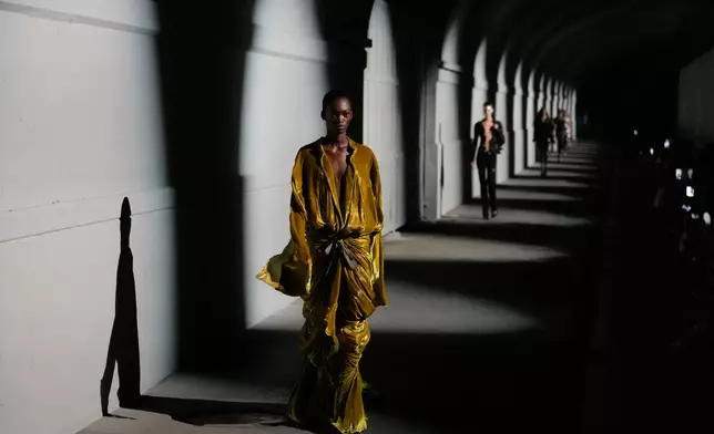 A model wears a creation part of The Attico women's Spring-Summer 2027 collection, presented in Milan, Italy, Friday, Sept. 25, 2026. (AP Photo/Luca Bruno)