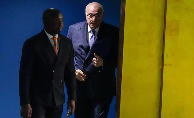 Algeria's Minister of Foreign Affairs Ahmed Attaf is escorted to the podium to address the 81st session of the United Nations General Assembly at United Nations headquarters, Monday, Sept. 28, 2026. (AP Photo/Yuki Iwamura)
