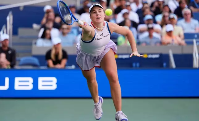 Linda Noskova, of the Czech Republic, reaches to return the ball to Aryna Sabalenka, of Belarus, during the quarterfinal round of the U.S. Open tennis championships, Tuesday, Sept. 8, 2026, in New York. (AP Photo/Seth Wenig)
