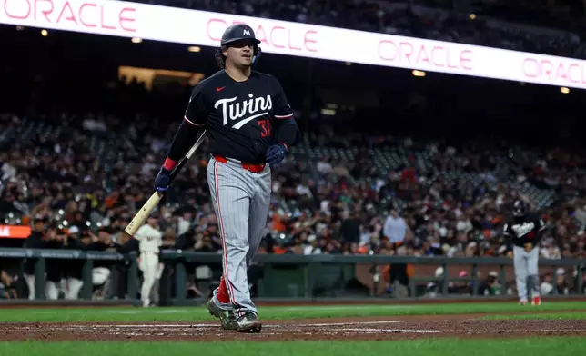 Minnesota Twins' Aaron Sabato walks back to the dugout after striking out during the second inning of a baseball game against the San Francisco Giants in San Francisco, Monday, Sept. 21, 2026. (AP Photo/Jed Jacobsohn)