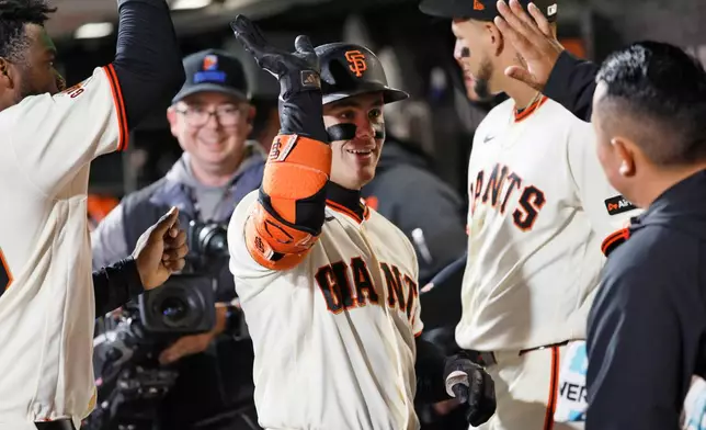 San Francisco Giants' Drew Gilbert, center, celebrates after his home run against the Minnesota Twins in the fifth inning of a baseball game in San Francisco, Monday, Sept. 21, 2026. (Santiago Mejia/San Francisco Chronicle via AP)