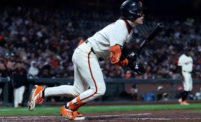San Francisco Giants' Drew Gilbert watches his two-run single during the second inning of a baseball game against the Minnesota Twins in San Francisco, Monday, Sept. 21, 2026. (AP Photo/Jed Jacobsohn)