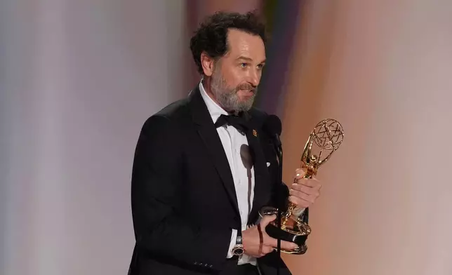 Matthew Rhys accepts the award for outstanding lead actor in a limited or anthology series or movie for "The Beast In Me" during the 78th Emmy Awards on Monday, Sept. 14, 2026, at the Peacock Theater in Los Angeles. (AP Photo/Chris Pizzello)