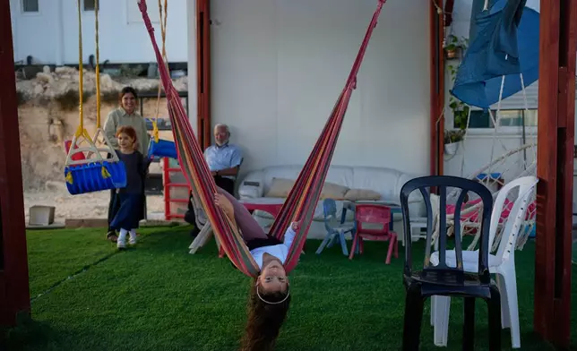 Israeli settlers gather to celebrate the inauguration of a newly built synagogue at the occupied West Bank outpost of Homesh, Wednesday, Sept. 16, 2026. (AP Photo/Ohad Zwigenberg)