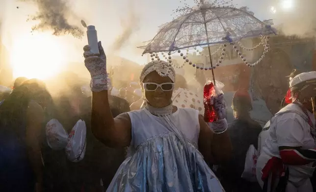 People participate in J'Ouvert festivities ahead of the West Indian Day Parade at sunrise on Labor Day in the Crown Heights and Flatbush neighborhoods of Brooklyn, Monday, Sept. 7, 2026, in New York. (AP Photo/Angelina Katsanis)