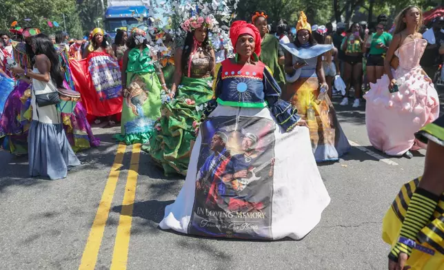 Members of the Lespri Ayiti Haitian carnival band participate in the West Indian Day Parade on Monday, Sept. 7, 2026, in the Brooklyn borough of New York. (AP Photo/Heather Khalifa)