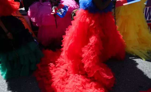 Members of the Haitian group Lamar wait for the start of the West Indian Day Parade on Monday, Sept. 7, 2026, in the Brooklyn borough of New York. (AP Photo/Heather Khalifa)