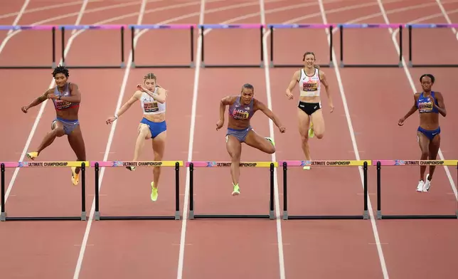 From left: Anna Cockrell, of the United States, Emma Zapletalova, of Slovakia, Jasmine Jones, of the United States, Paulien Couckuyt, of Belgium, and Dalilah Muhammad, of the United States, compete in the women's 400 meters hurdle final during the World Athletics Ultimate Championship in Budapest, Hungary, Sunday, Sept. 13, 2026. (AP Photo/Armin Durgut)