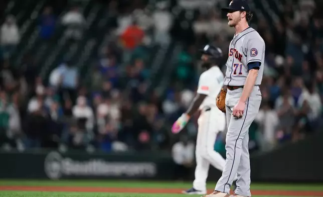 Houston Astros relief pitcher Josh Hader reacts after driving in a run by walking Seattle Mariners' Julio Rodríguez with the bases loaded during the 10th inning of a baseball game, Wednesday, Sept. 23, 2026, in Seattle. (AP Photo/Lindsey Wasson)