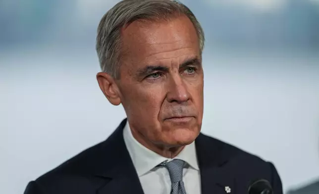 Canadian Prime Minister Mark Carney listens during an announcement about funding for oceans protection, in North Vancouver, British Columbia, Tuesday, Sept. 29, 2026. (Darryl Dyck/The Canadian Press via AP)