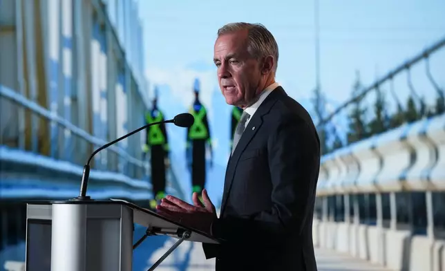 Canadian Prime Minister Mark Carney speaks after LNG Canada said it will go ahead with the Phase 2 expansion project at its LNG terminal in Kitimat, British Columbia, during an announcement in Vancouver, Tuesday, Sept. 29, 2026. (Darryl Dyck/The Canadian Press via AP)