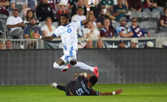 CF Montréal defender Brayan Ceballos, top, flies over Colorado Rapids defender Loïc Williams in the first half of an MLS soccer match Saturday, Sept. 12, 2026, in Dick's Sporting Goods Park in Commerce City, Colo. (AP Photo/David Zalubowski)