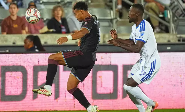 Colorado Rapids defender Loïc Williams, left, collects the ball as CF Montréal forward Prince Owusu, right, defends in the first half of an MLS soccer match Saturday, Sept. 12, 2026, in Commerce City, Colo. (AP Photo/David Zalubowski)