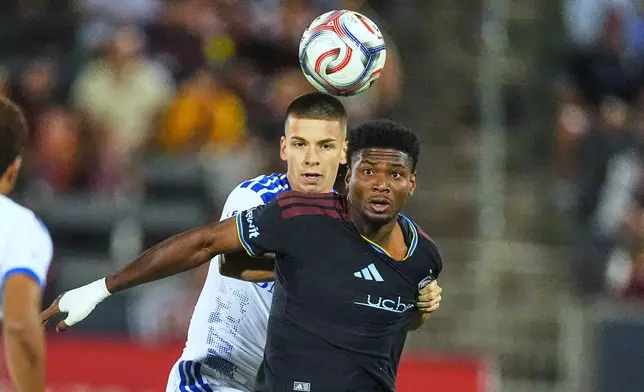 Colorado Rapids forward Donavan Phillip, front, pursues the ball with CF Montréal defender Viktor Radojević in the first half of an MLS soccer match Saturday, Sept. 12, 2026, in Dick's Sporting Goods Park in Commerce City, Colo. (AP Photo/David Zalubowski)