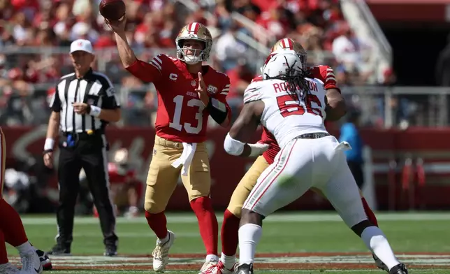 San Francisco 49ers quarterback Brock Purdy (13) passes against the Arizona Cardinals during the first half of an NFL football game in Santa Clara, Calif., Sunday, Sept. 27, 2026. (AP Photo/Jed Jacobsohn)