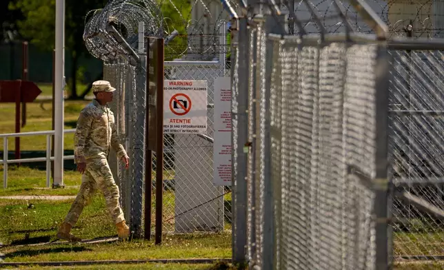 A U.S. serviceman enters a restricted area at the Mihail Kogalniceanu Air Base, in Mihail Kogalniceanu, Romania, Thursday, Sept. 10, 2026. (AP Photo/Andreea Alexandru)