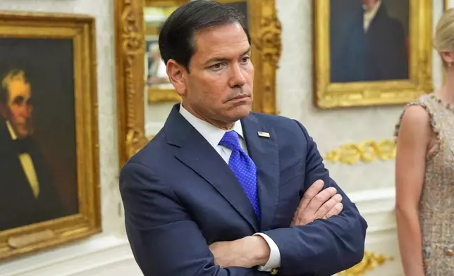Secretary of State Marco Rubio listens as President Donald Trump speaks during an event about healthcare in the Oval Office of the White House, Friday Sept. 18, 2026, in Washington. (AP Photo/Jacquelyn Martin)