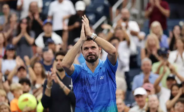Stan Wawrinka, of Switzerland, gestures to the crowd after he lost to Matteo Berrettini, of Italy, during the first round of the U.S. Open tennis championships Monday, Aug. 31, 2026, in New York. (AP Photo/Adam Hunger)