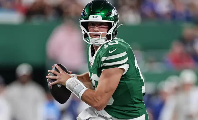 New York Jets quarterback Cade Klubnik (10) runs with the ball during the first half of a preseason NFL football game against the New York Giants, Friday, Aug. 28, 2026, in East Rutherford, N.J. (AP Photo/Adam Hunger)