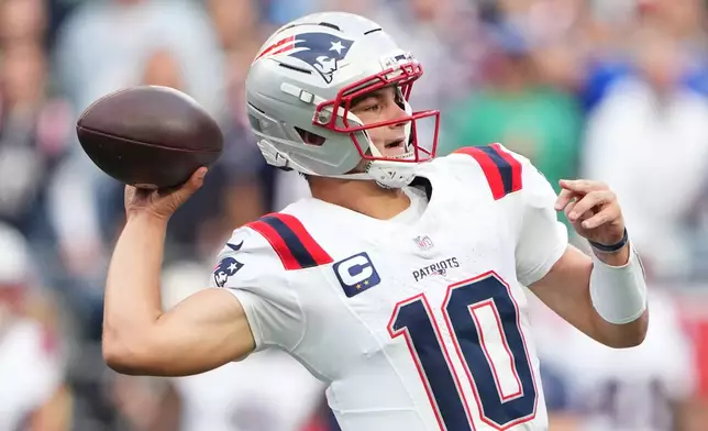 New England Patriots quarterback Drake Maye (10) throes a pass during the first half of an NFL football game against the Seattle Seahawks, Wednesday, Sept. 9, 2026, in Seattle. (AP Photo/Lindsey Wasson)