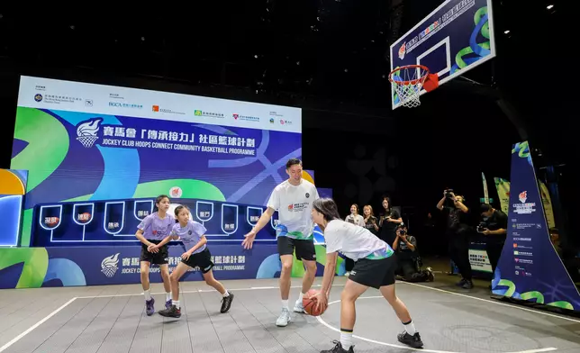Local elite basketball players and ALBA coaches interact with young people in a skills demonstration at the kick-off ceremony of the Jockey Club Hoops Connect Community Basketball Programme. Photo source: HKJC