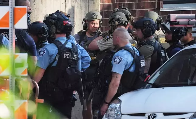 Law enforcement respond to a shooting Wednesday, Sept. 2, 2026, in downtown Minneapolis. (AP Photo/Ellen Schmidt)