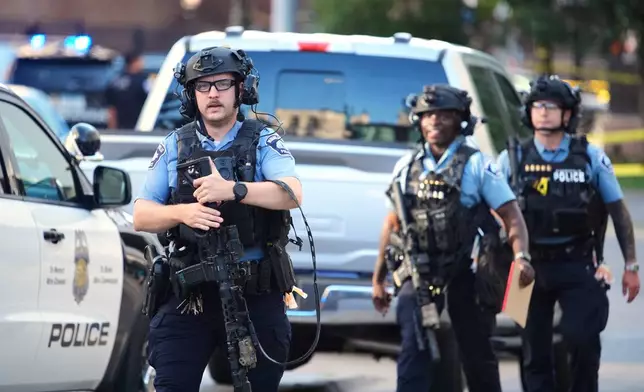Police respond to a shooting Wednesday, Sept. 2, 2026, in downtown Minneapolis. (AP Photo/Ellen Schmidt)